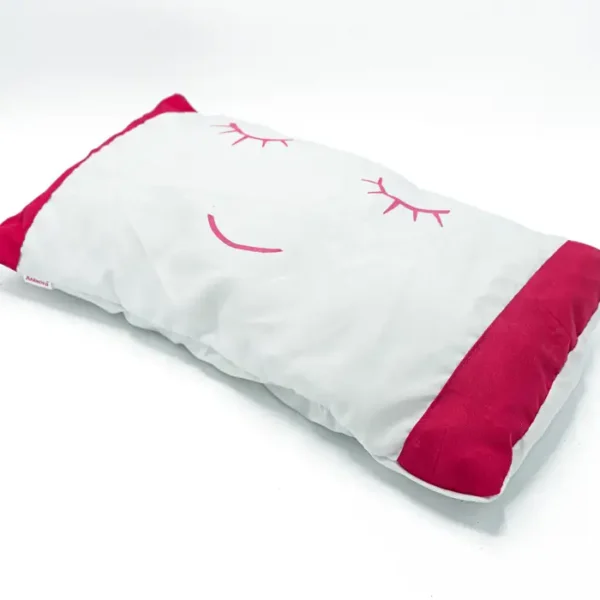 Oreiller bébé blanc motif yeux endormis rose
